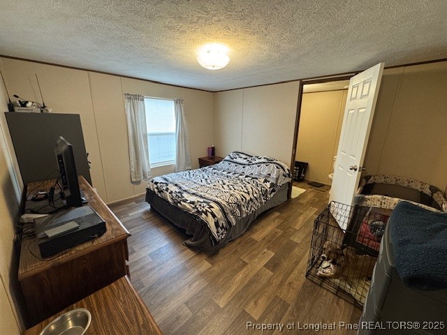 176 Fire Tower Road Orrum, NC 28369 - Photo 7 of 14 a bedroom with a bed and a flat tv screen on the dresser