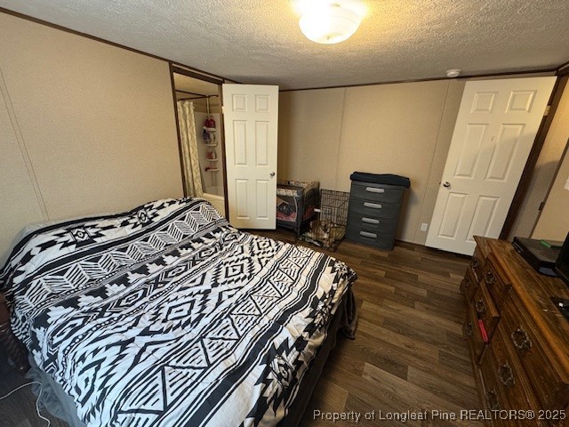 176 Fire Tower Road Orrum, NC 28369 - Photo 8 of 14 a bedroom with a bed and wooden floor