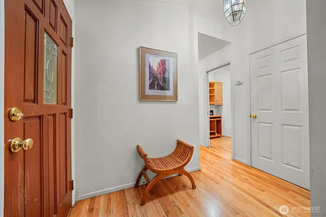 a blue bed sitting in a room next to a window