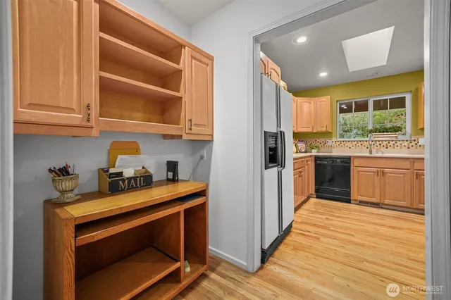 a kitchen with stainless steel appliances granite countertop a stove and a sink
