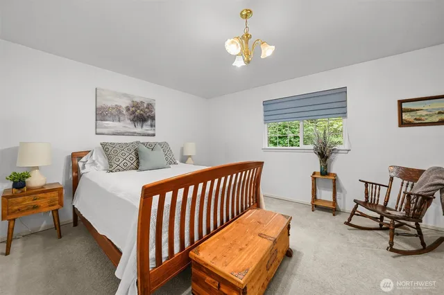 a bedroom with furniture and a window