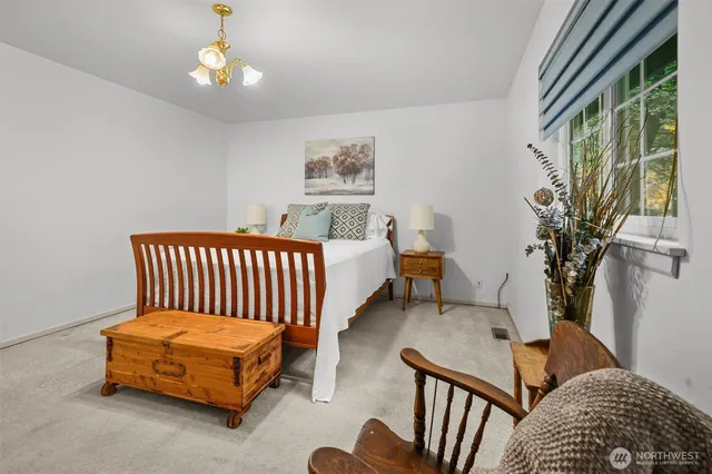 a bedroom with furniture and a window