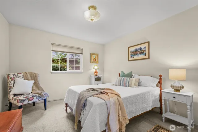 a bedroom with bed and a window