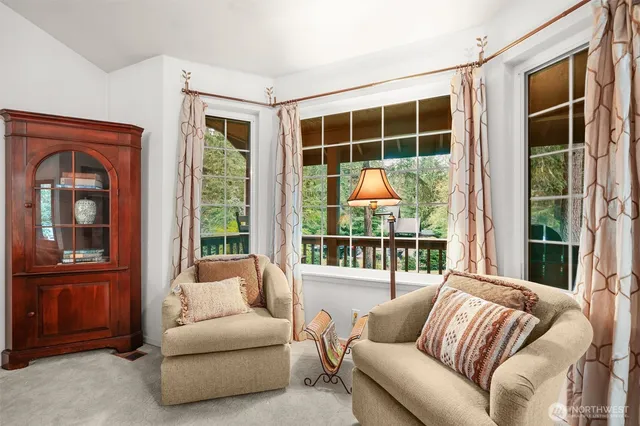 a living room with furniture and windows