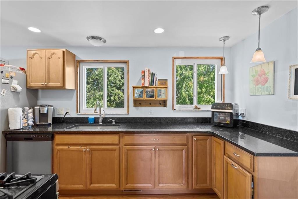 951 Highview Road Pittsburgh, PA 15234 - Photo 3 of 25 a kitchen with granite countertop a sink a window stainless steel appliances and cabinets