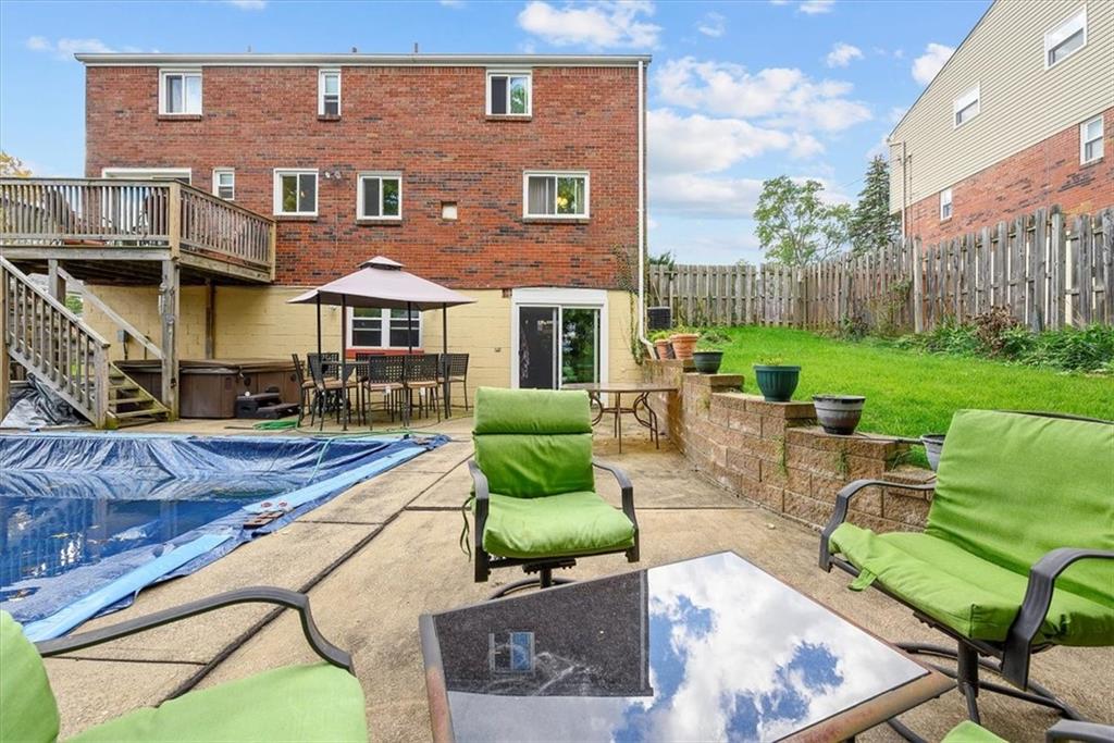 951 Highview Road Pittsburgh, PA 15234 - Photo 23 of 25 a view of a patio with couches table and chairs with plants and wooden fence