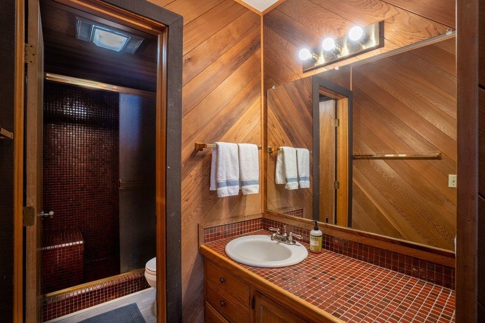 2090 Chalet Road, Unit 16 Alpine Meadows, CA 96146 - Photo 11 of 20 a bathroom with a sink a mirror and a shower
