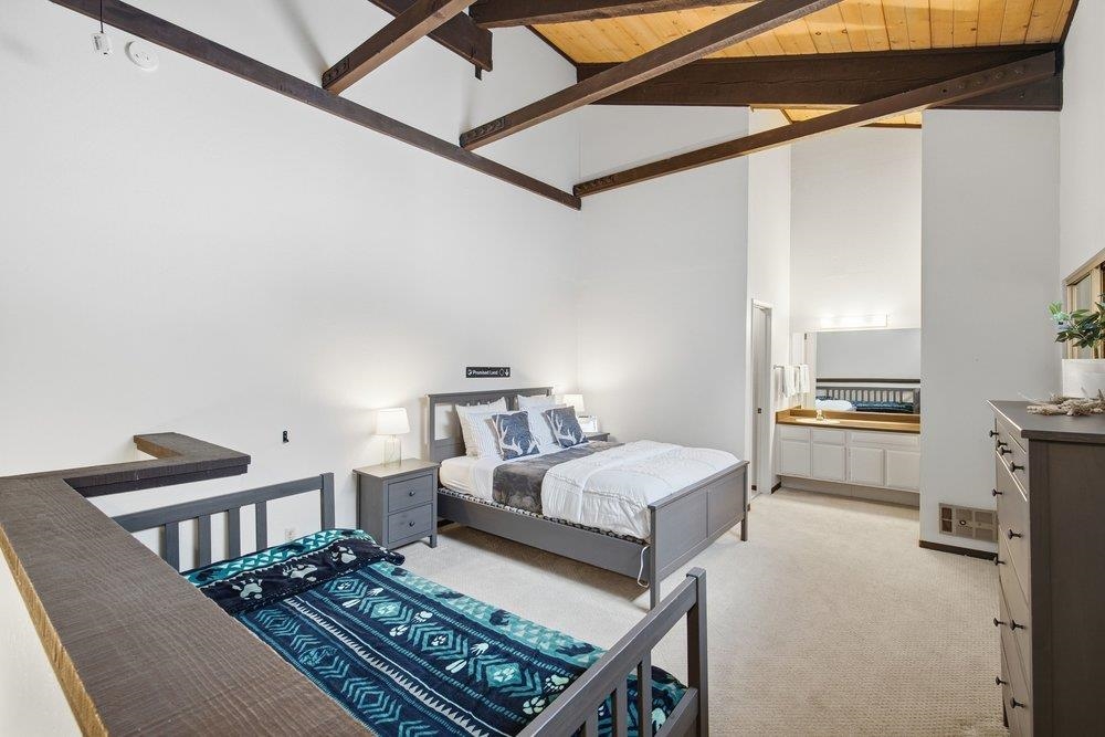 2090 Chalet Road, Unit 16 Alpine Meadows, CA 96146 - Photo 14 of 20 a bedroom with a bed next to a window