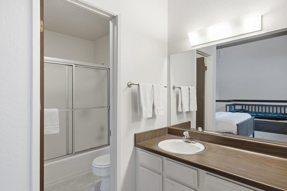 2090 Chalet Road, Unit 16 Alpine Meadows, CA 96146 - Photo 14 of 20 a bathroom with a granite countertop sink toilet and shower