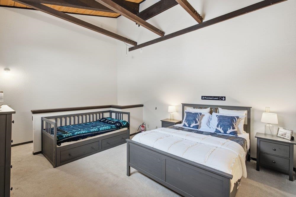 2090 Chalet Road, Unit 16 Alpine Meadows, CA 96146 - Photo 15 of 20 a bedroom with a bed and a dresser