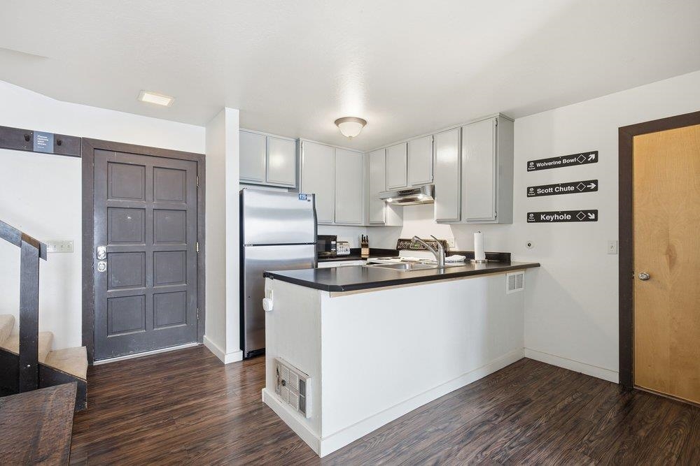 2090 Chalet Road, Unit 16 Alpine Meadows, CA 96146 - Photo 4 of 20 a kitchen with granite countertop a refrigerator and a sink