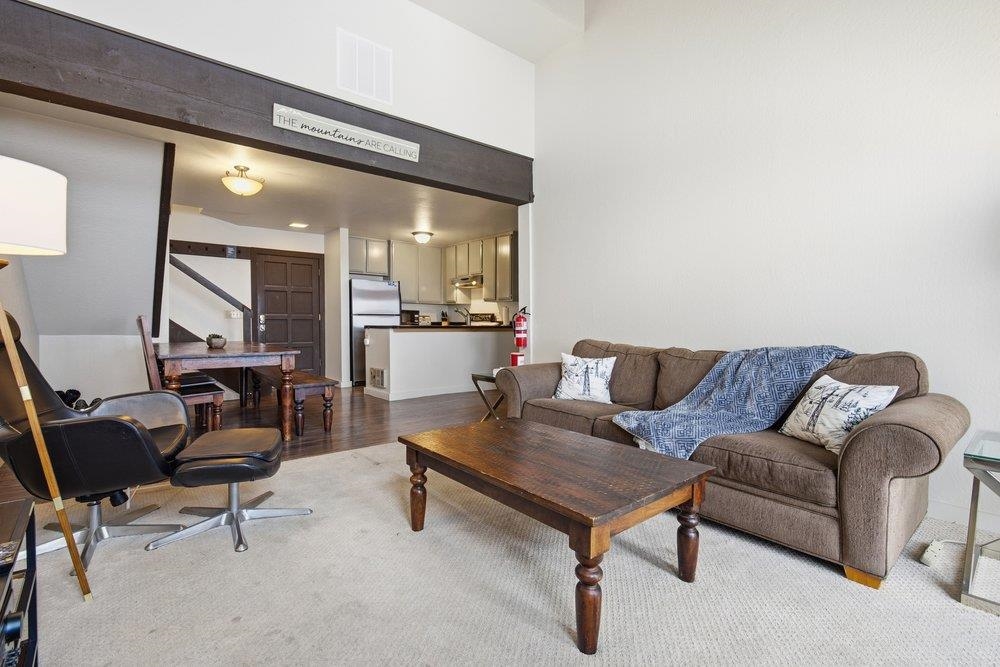 2090 Chalet Road, Unit 16 Alpine Meadows, CA 96146 - Photo 9 of 20 a living room with furniture and a table