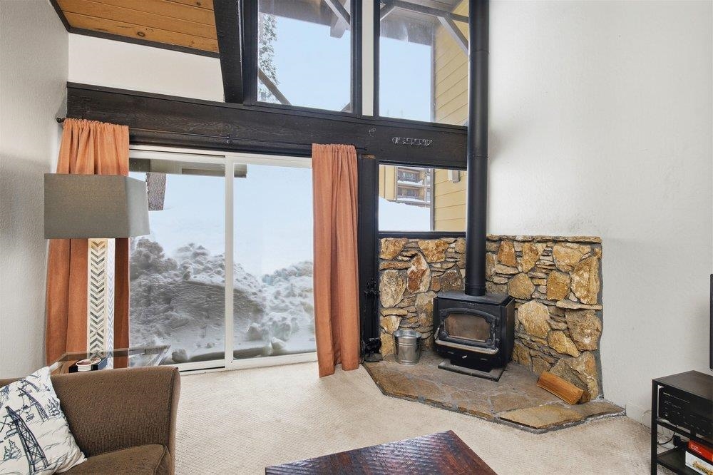 2090 Chalet Road, Unit 16 Alpine Meadows, CA 96146 - Photo 10 of 20 a living room with furniture a floor to ceiling window