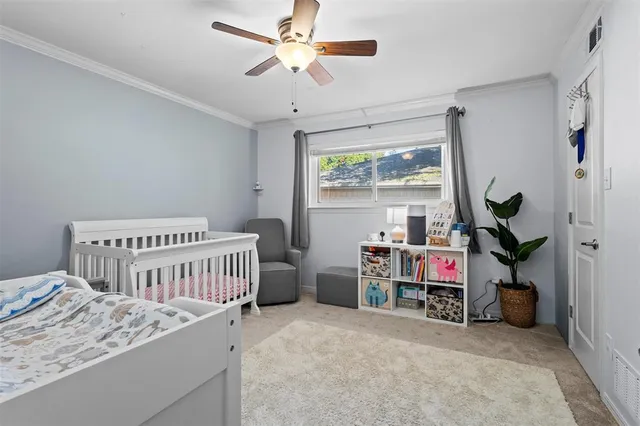 a bedroom with furniture and a window
