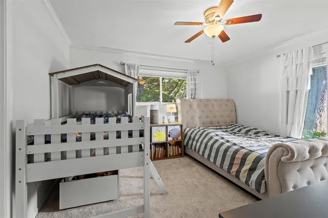 a bedroom with bed and window