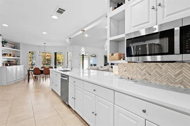 a kitchen with stainless steel appliances lots of counter top space