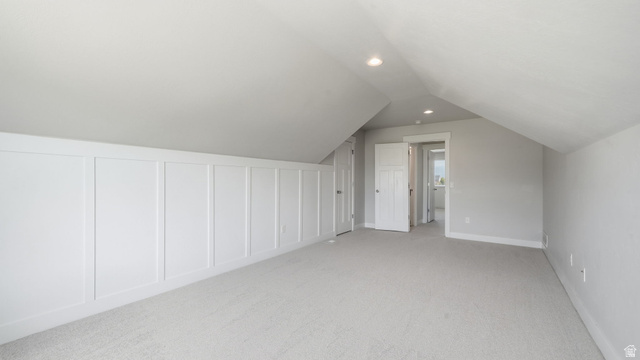 111 East Silver Oak Road Vineyard, UT 84059 - Photo 30 of 50 Carpeted room featuring a white paneled accent wall, recessed lighting, and a sloped ceiling