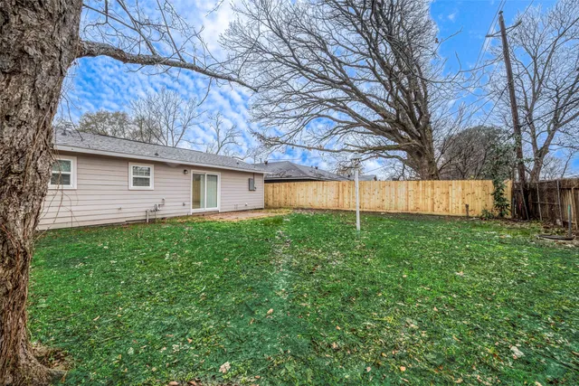 a view of a house with a back yard