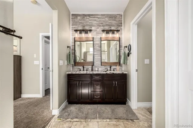 a kitchen with a refrigerator and a sink