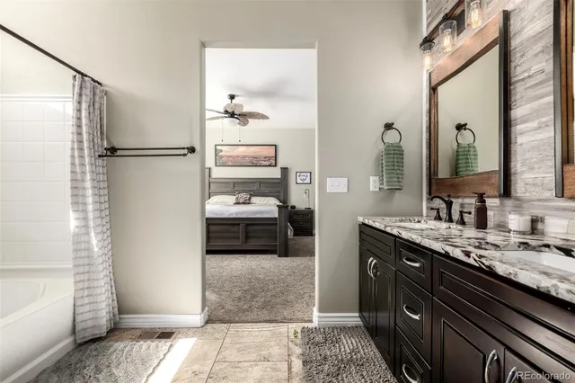 a bathroom with a bathtub and a shower