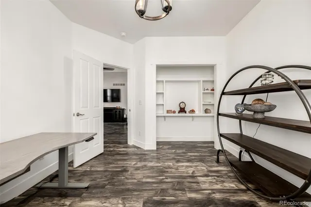 a bathroom with a sink a toilet a mirror a vanity and shower