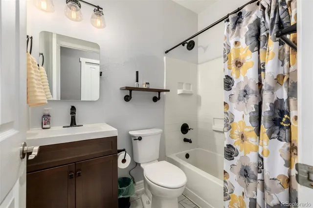 a patio with yard glass top table and chairs