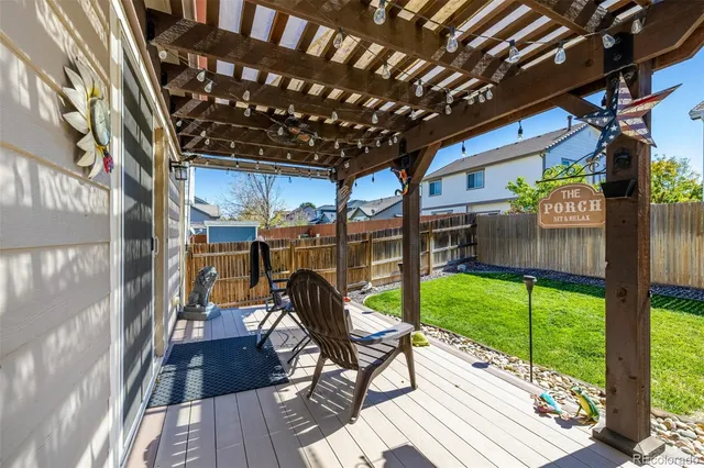 a view of a house with backyard and porch