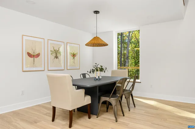 a dining room with furniture and window