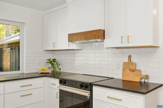 a kitchen with a stove and cabinets