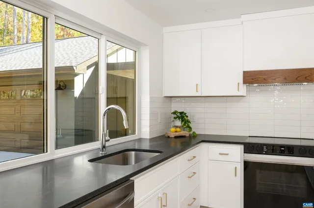 a kitchen with a sink and a window