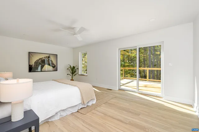 a bedroom with a bed and a table in it