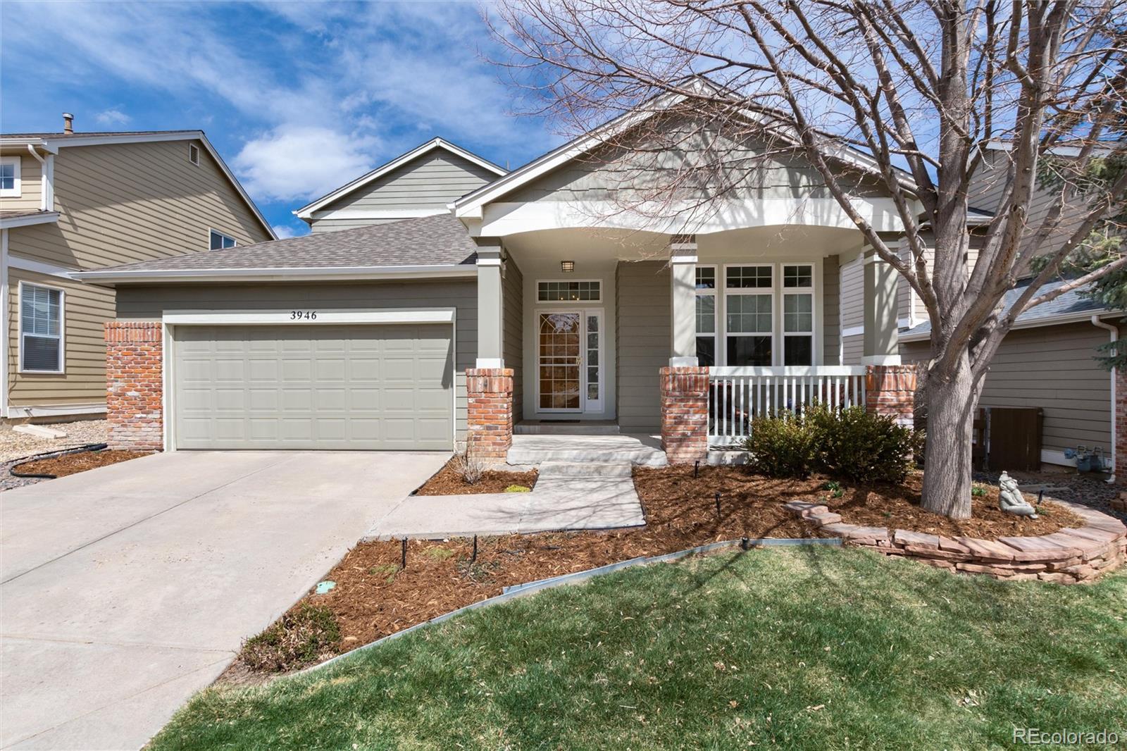 3946 Mallard Street Highlands Ranch, CO 80126 - Photo 1 of 40 a front view of a house with garden