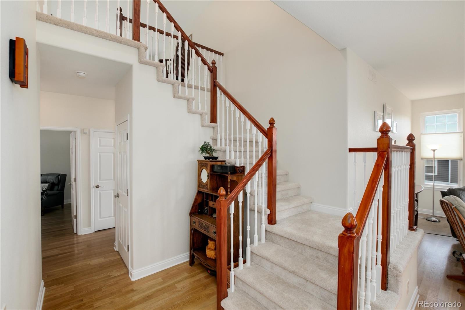 3946 Mallard Street Highlands Ranch, CO 80126 - Photo 12 of 40 a view of entryway with wooden floor and stairs