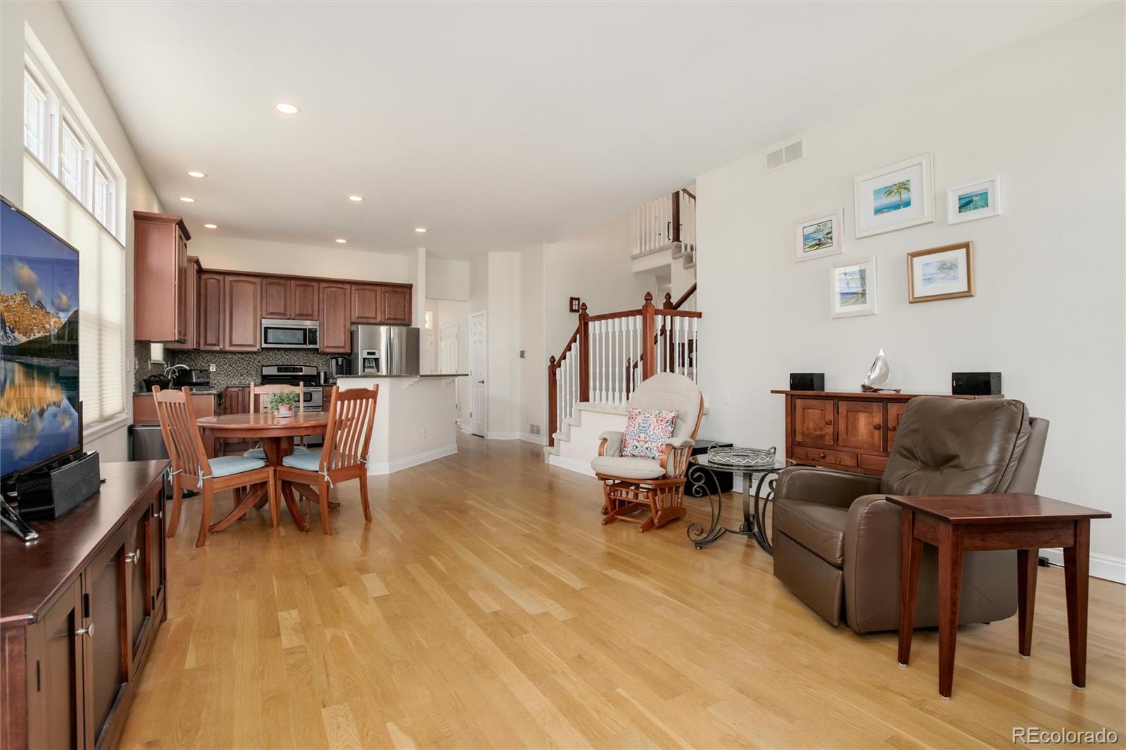 3946 Mallard Street Highlands Ranch, CO 80126 - Photo 15 of 40 a living room with lots of furniture and kitchen view