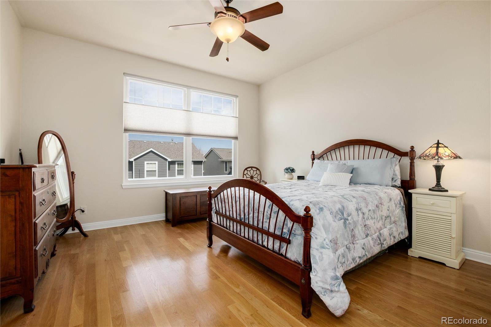 3946 Mallard Street Highlands Ranch, CO 80126 - Photo 16 of 40 a bedroom with a bed and a window
