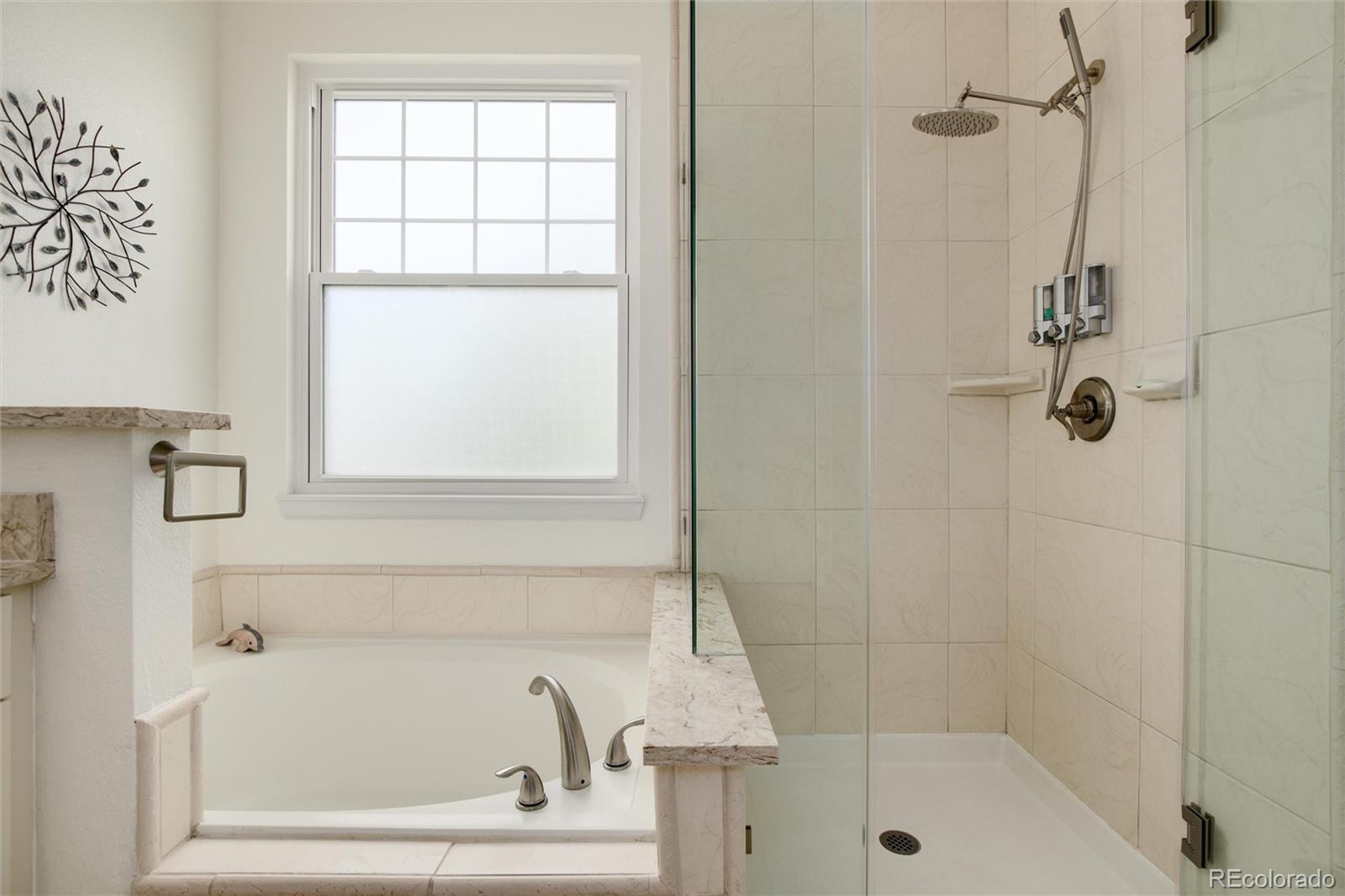 3946 Mallard Street Highlands Ranch, CO 80126 - Photo 19 of 40 a bathroom with a bathtub