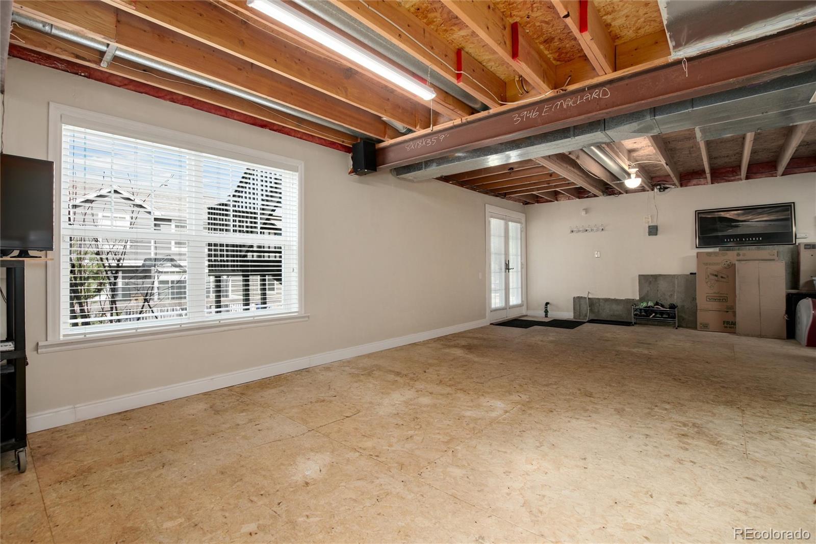 3946 Mallard Street Highlands Ranch, CO 80126 - Photo 27 of 40 a view of a room with wooden walls and roof