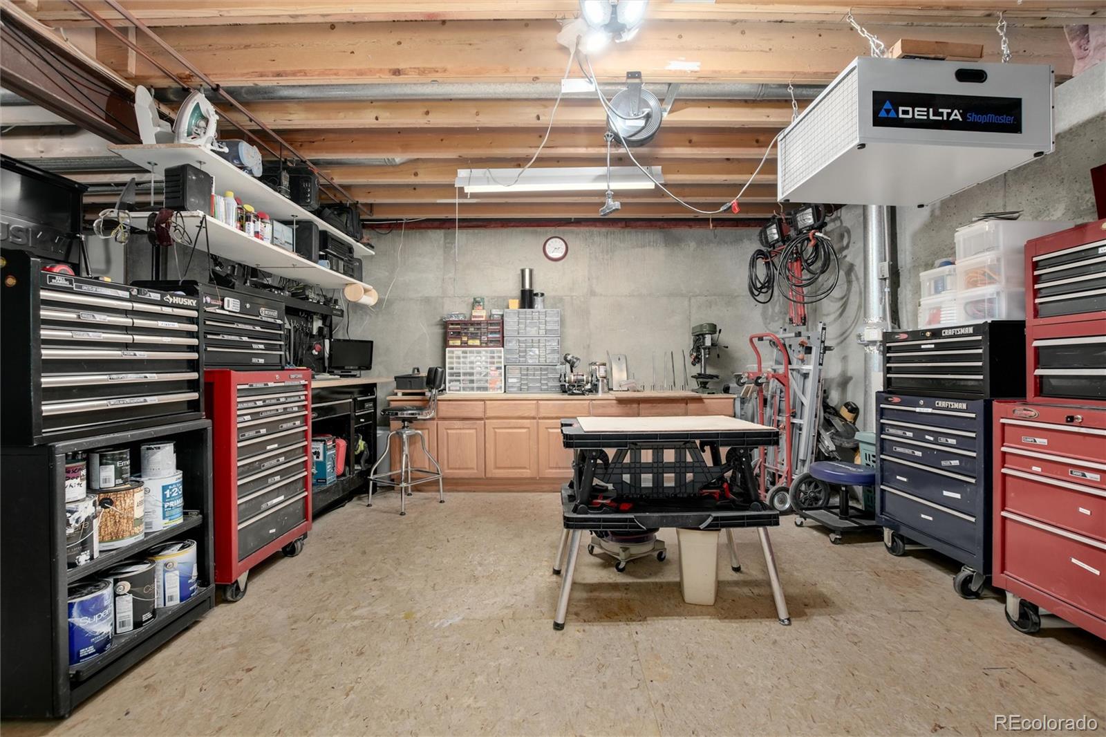 3946 Mallard Street Highlands Ranch, CO 80126 - Photo 29 of 40 a kitchen with furniture and a fireplace