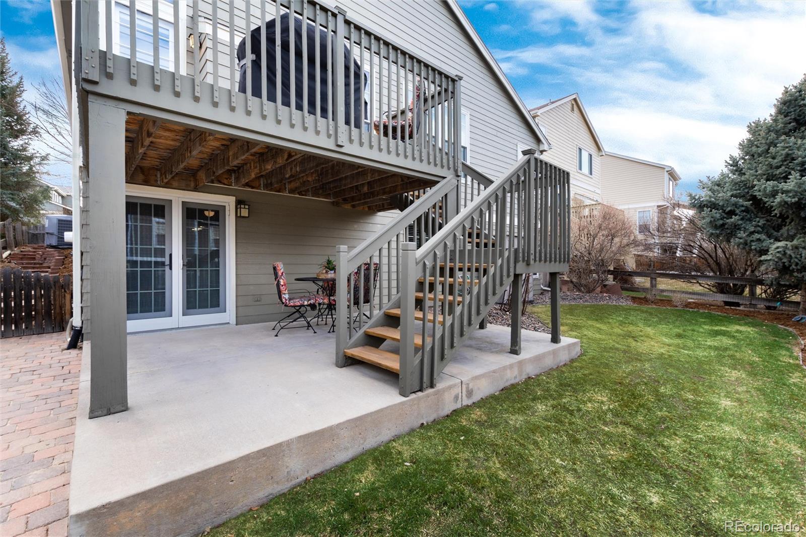 3946 Mallard Street Highlands Ranch, CO 80126 - Photo 32 of 40 a view of a house with a yard