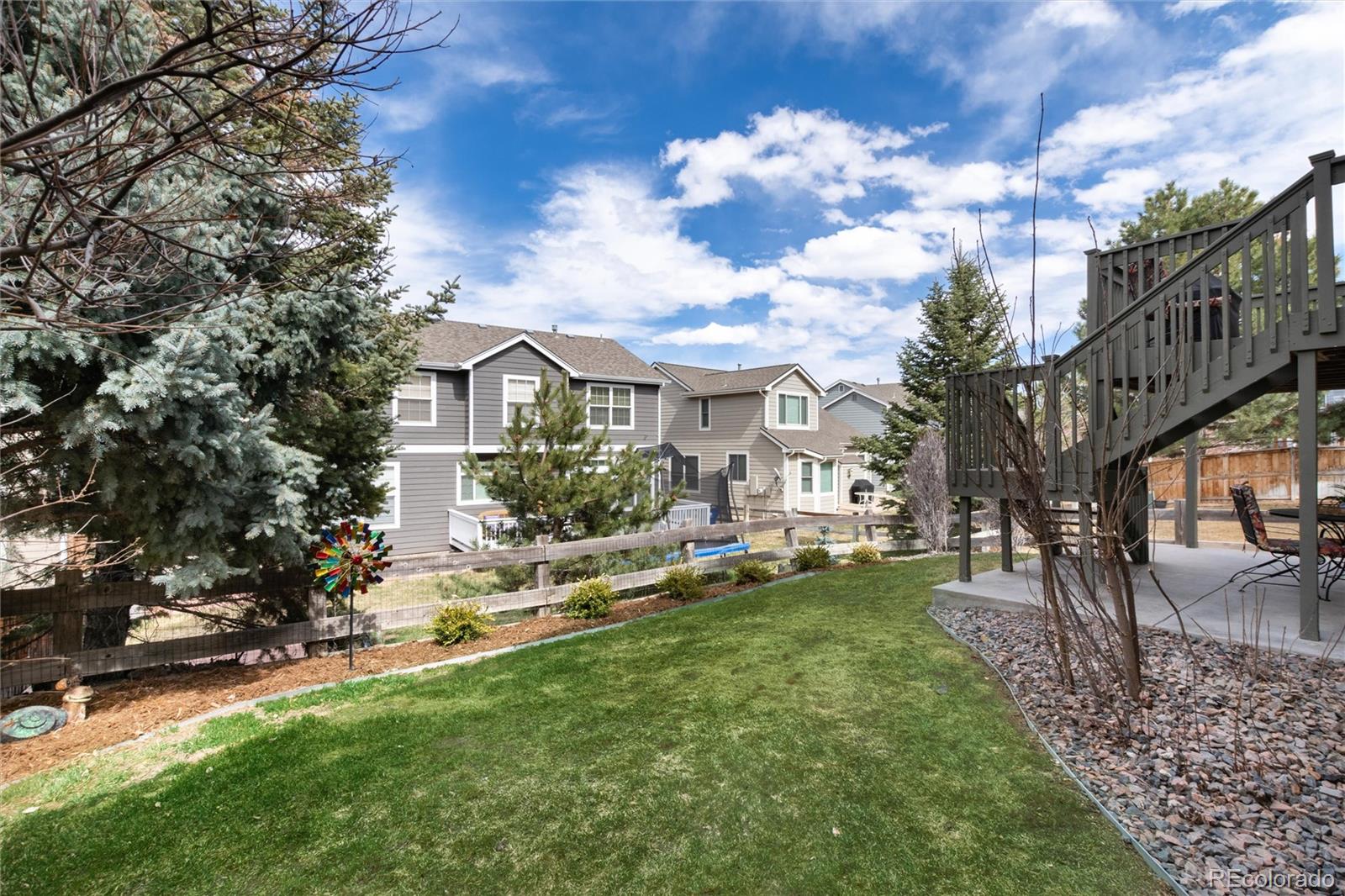 3946 Mallard Street Highlands Ranch, CO 80126 - Photo 35 of 40 a view of a house with a yard