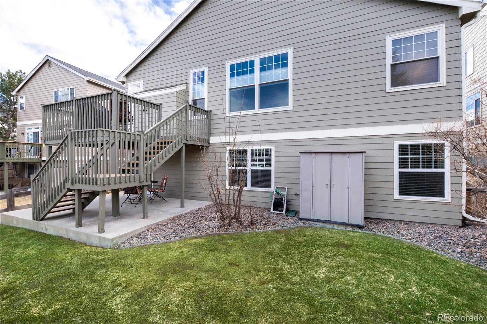 3946 Mallard Street Highlands Ranch, CO 80126 - Photo 36 of 40 a view of house with a yard and wooden deck