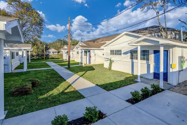 a view of a house with a yard