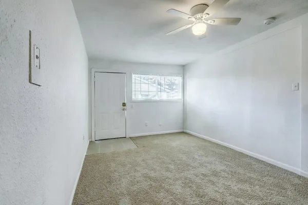 a view of an empty room with a window