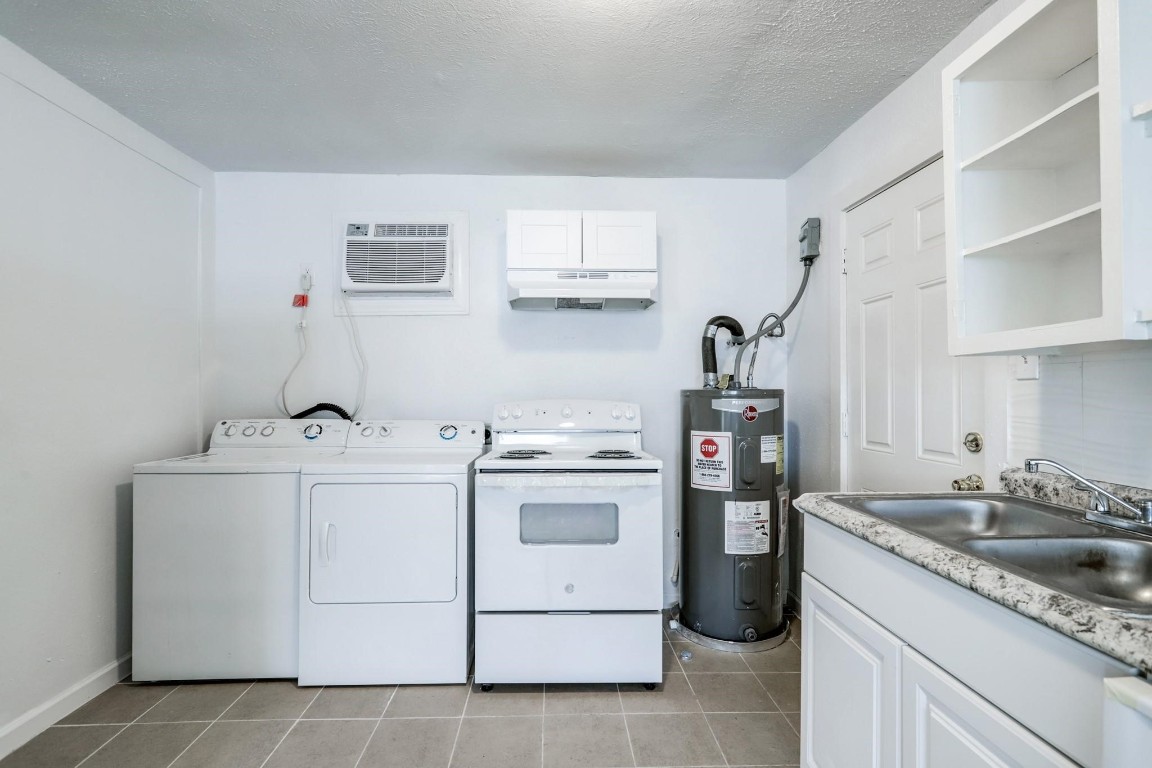 3823 Lydia Street Houston, TX 77021 - Photo 17 of 18 a kitchen with cabinets appliances and a sink