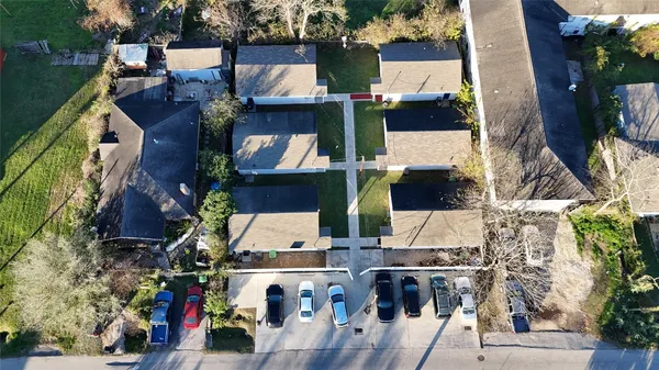 an aerial view of houses with outdoor space