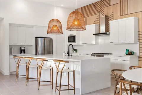 a kitchen with stainless steel appliances granite countertop a sink and cabinets