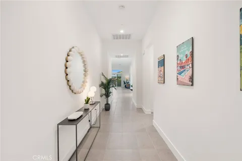 a large white bed in a white room