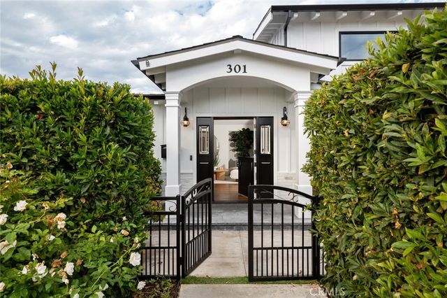 a view of a patio with table and chairs and potted plants