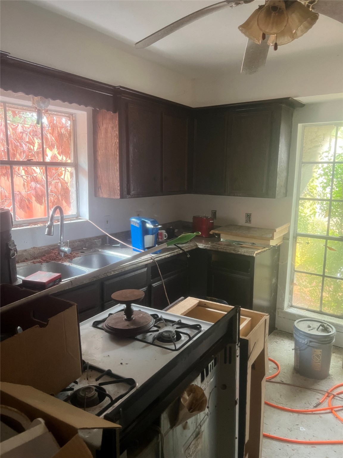 16707 Waycreek Road Houston, TX 77068 - Photo 13 of 29 a kitchen with a stove a sink and a window
