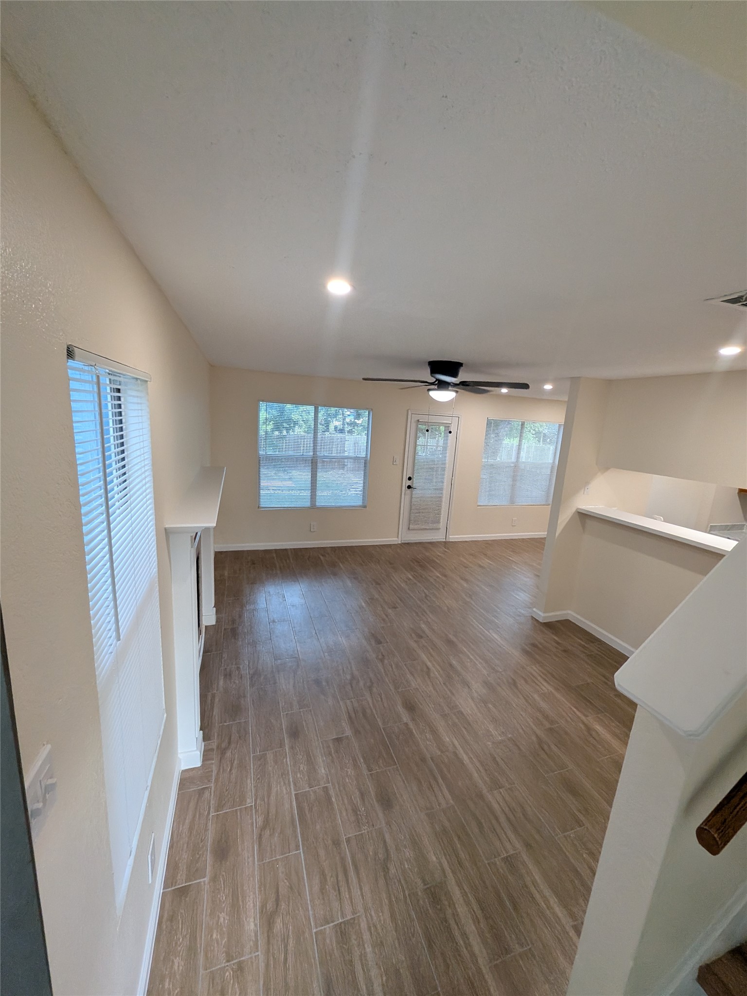 13303 Lyndhurst Street, Unit B Austin, TX 78729 - Photo 13 of 13 An open floorplan living area showcases rich tile flooring and abundant natural light.